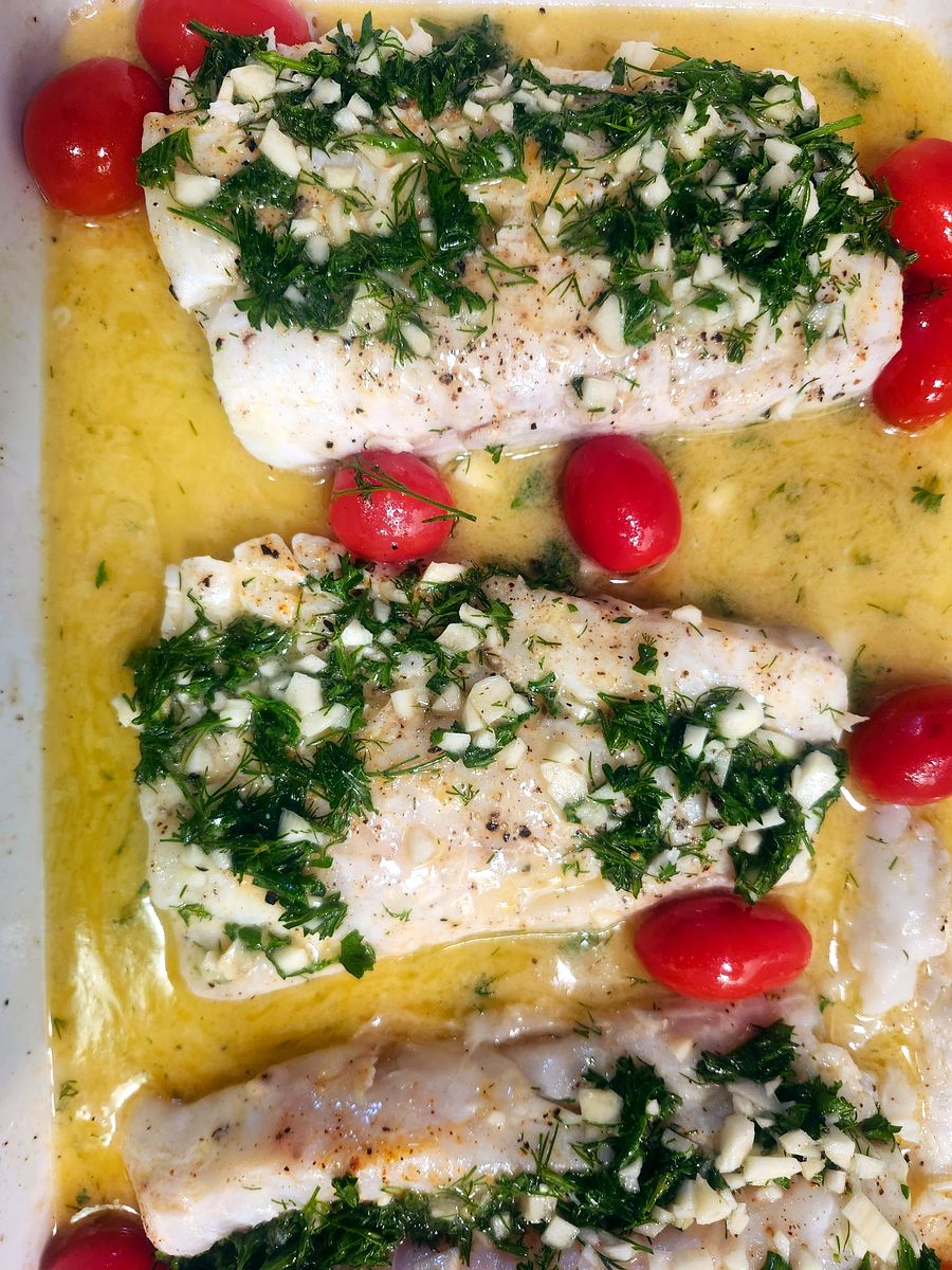 Garlic and dill baked fish with cherry tomatoes