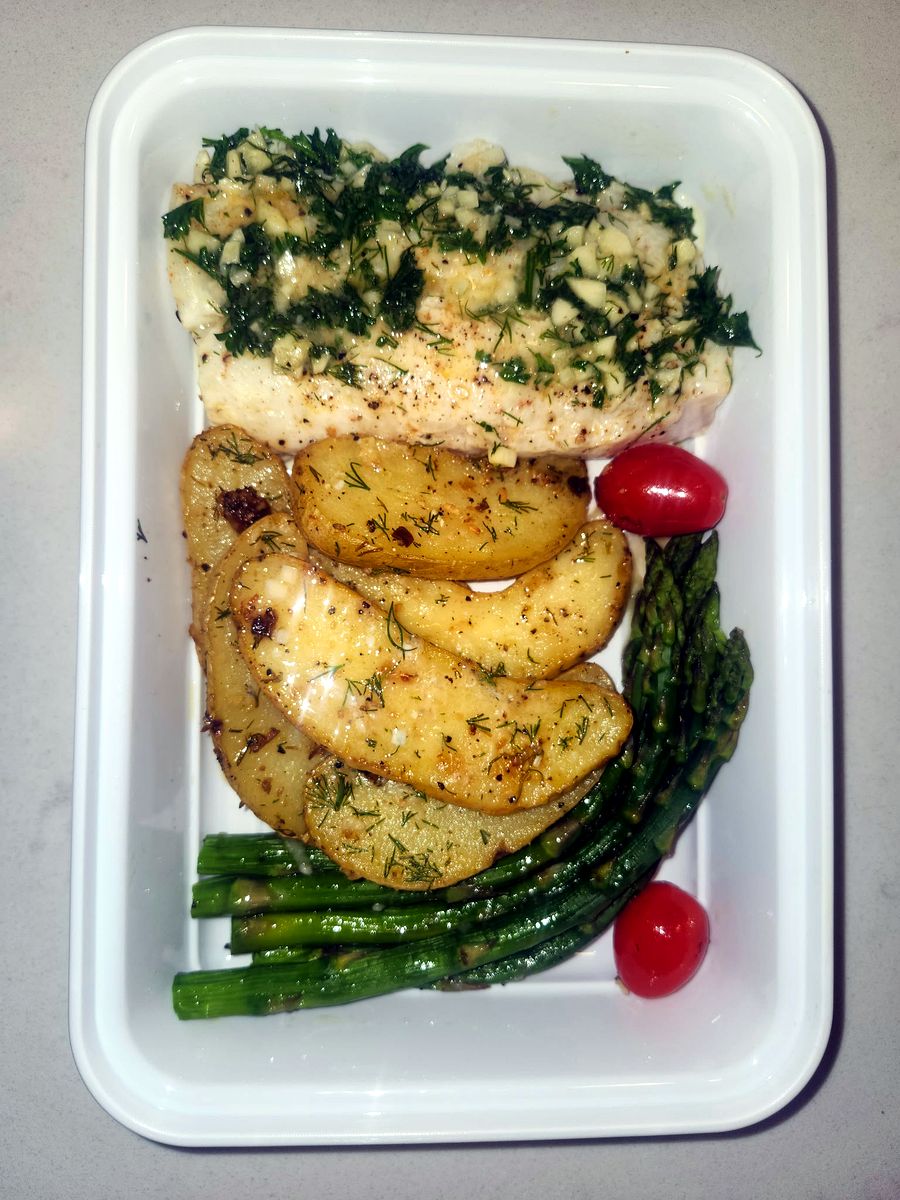 Herb-baked fish with roasted potatoes and asparagus